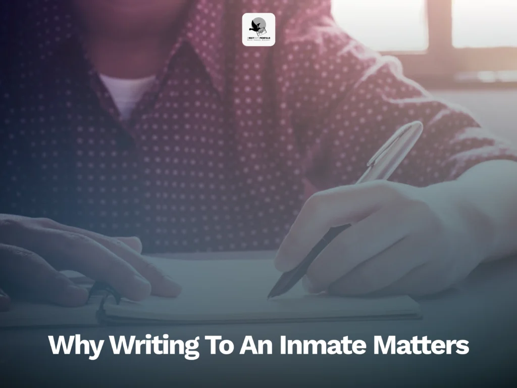 Person writing in a notebook, with the text “Why Writing To An Inmate Matters” displayed below.