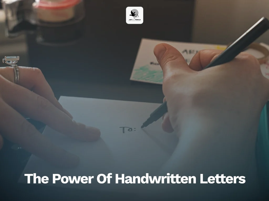 A close-up of hands writing "To:" on an envelope with a pen, with other stationery items in the background; text overlay reads, "The Power Of Handwritten Letters.